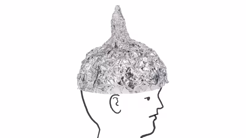 Comic illustration showing the human wearing an aluminum hat as protection.